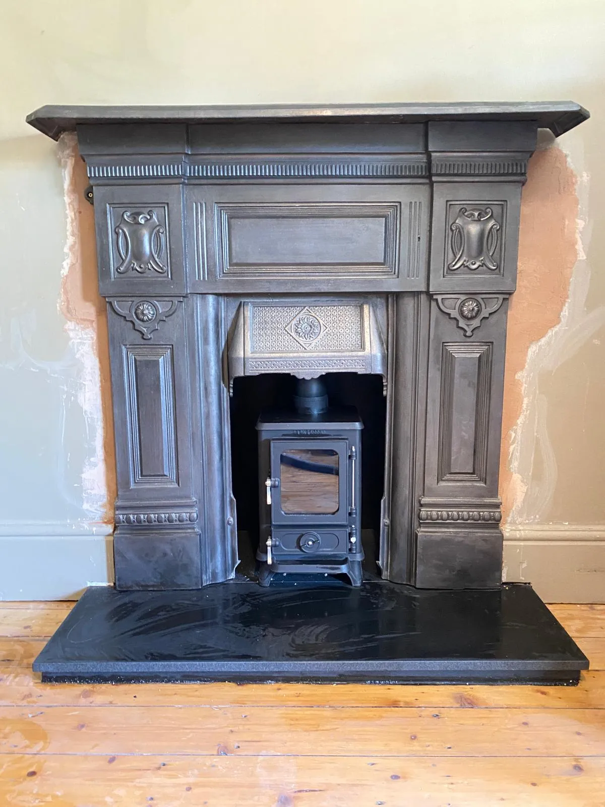 Modern stove in renovated fireplace