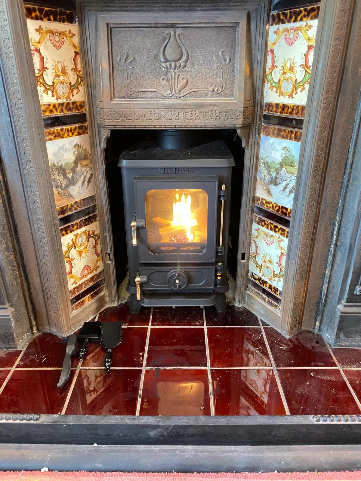 Traditional cast iron stove with decorative tiles
