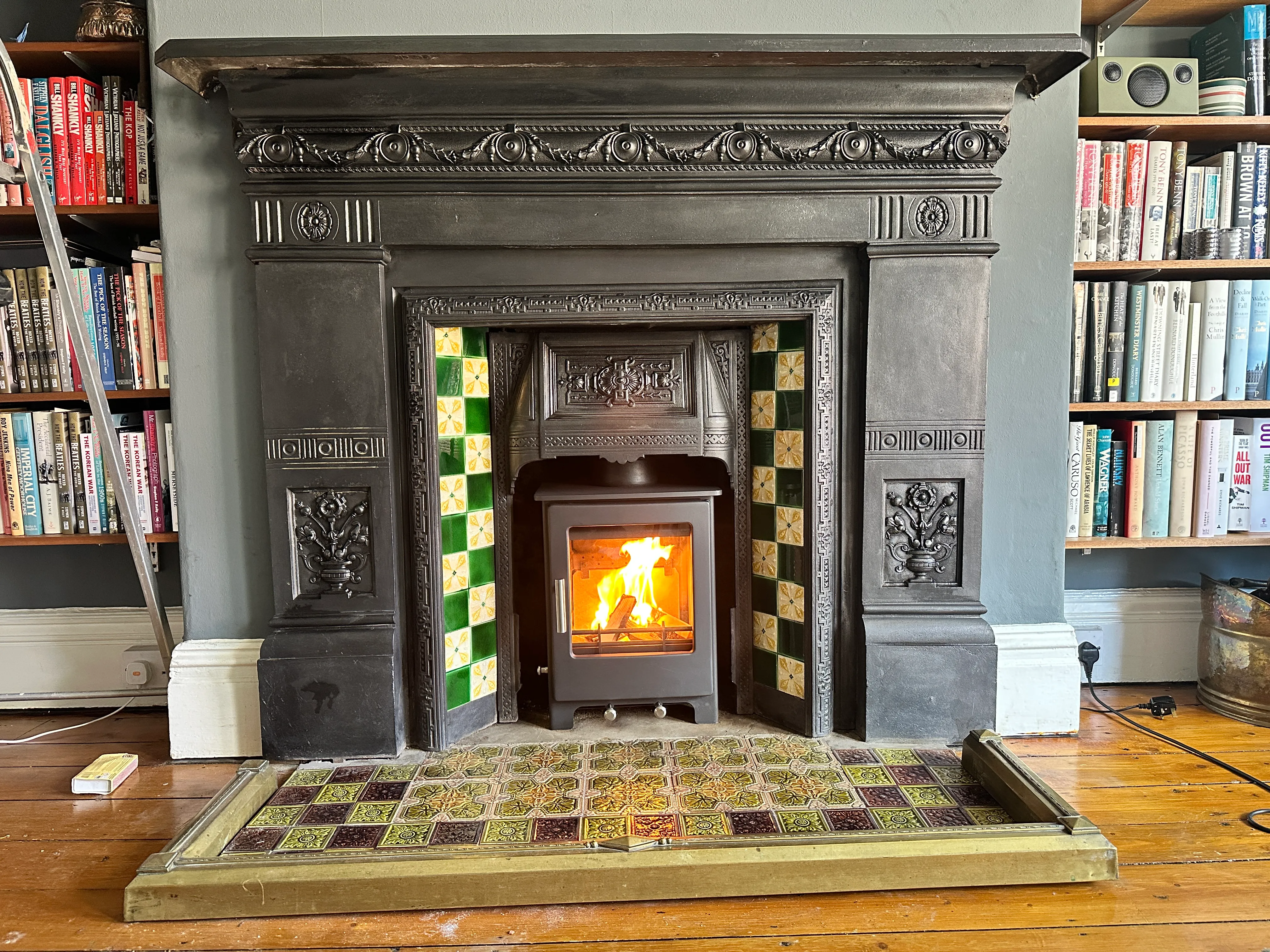 Period cast-iron fireplace restoration with fitted stove